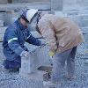 Two men working on a cold chilly Saturday morning making sure every steps fits in perfectly.  